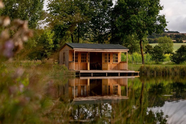 a lake house in the kent countryside at wildshark vineyard